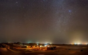 Stargazing in the Sahara Desert near M'Hamid Morocco under a clear winter night sky