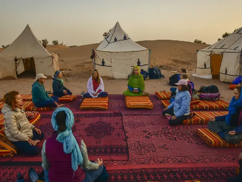 Sunrise yoga meditation retreat in Sahara Desert M'Hamid Morocco
